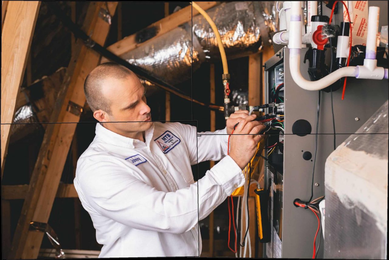 Image showing technicians repairing a Ruud HVAC system in Cream Ridge, NJ.